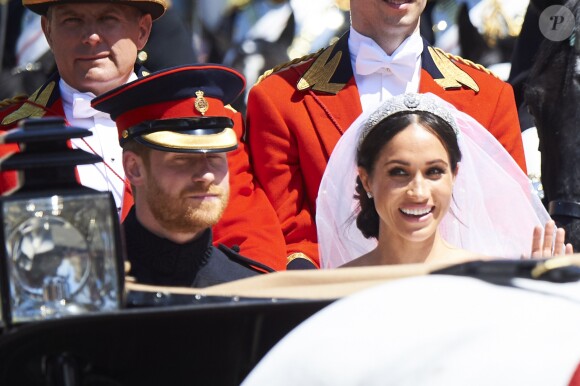 Le prince Harry et Meghan Markle, duc et duchesse de Sussex, ont effectué une procession dans le landau Ascot après leur mariage en la chapelle St George à Windsor le 19 mai 2018, à la rencontre du public dans toute la ville de Windsor et le long du Long Walk.