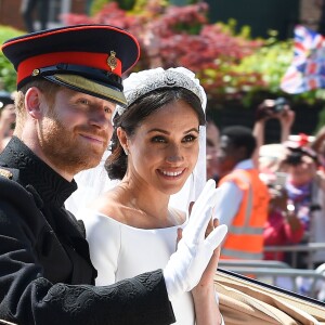 Le prince Harry et Meghan Markle, duc et duchesse de Sussex, ont effectué une procession dans le landau Ascot après leur mariage en la chapelle St George à Windsor le 19 mai 2018, à la rencontre du public dans toute la ville de Windsor et le long du Long Walk.