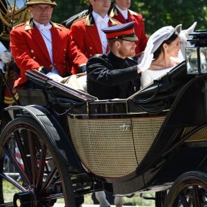 Le prince Harry et Meghan Markle, duc et duchesse de Sussex, ont effectué une procession dans le landau Ascot après leur mariage en la chapelle St George à Windsor le 19 mai 2018, à la rencontre du public dans toute la ville de Windsor et le long du Long Walk.