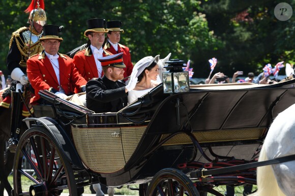 Le prince Harry et Meghan Markle, duc et duchesse de Sussex, ont effectué une procession dans le landau Ascot après leur mariage en la chapelle St George à Windsor le 19 mai 2018, à la rencontre du public dans toute la ville de Windsor et le long du Long Walk.