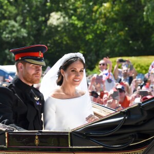 Le prince Harry et Meghan Markle, duc et duchesse de Sussex, ont effectué une procession dans le landau Ascot après leur mariage en la chapelle St George à Windsor le 19 mai 2018, à la rencontre du public dans toute la ville de Windsor et le long du Long Walk.