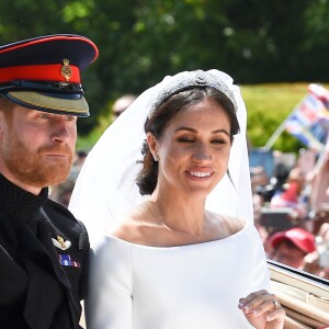 Le prince Harry et Meghan Markle, duc et duchesse de Sussex, ont effectué une procession dans le landau Ascot après leur mariage en la chapelle St George à Windsor le 19 mai 2018, à la rencontre du public dans toute la ville de Windsor et le long du Long Walk.