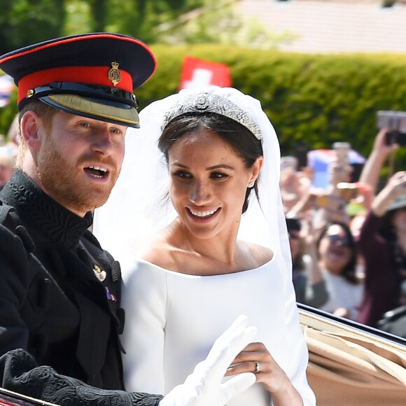 Le prince Harry et Meghan Markle, duc et duchesse de Sussex, ont effectué une procession dans le landau Ascot après leur mariage en la chapelle St George à Windsor le 19 mai 2018, à la rencontre du public dans toute la ville de Windsor et le long du Long Walk.