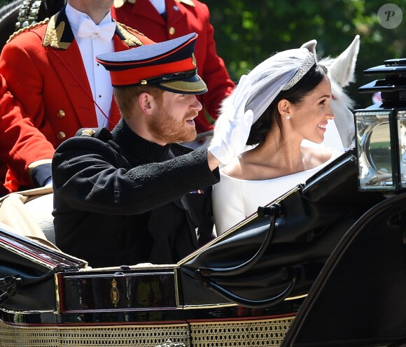 Le prince Harry et Meghan Markle, duc et duchesse de Sussex, ont effectué une procession dans le landau Ascot après leur mariage en la chapelle St George à Windsor le 19 mai 2018, à la rencontre du public dans toute la ville de Windsor et le long du Long Walk.