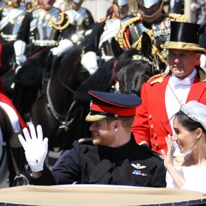 Le prince Harry et Meghan Markle, duc et duchesse de Sussex, ont effectué une procession dans le landau Ascot après leur mariage en la chapelle St George à Windsor le 19 mai 2018, à la rencontre du public dans toute la ville de Windsor et le long du Long Walk.