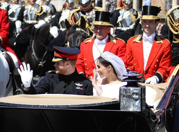 Le prince Harry et Meghan Markle, duc et duchesse de Sussex, ont effectué une procession dans le landau Ascot après leur mariage en la chapelle St George à Windsor le 19 mai 2018, à la rencontre du public dans toute la ville de Windsor et le long du Long Walk.