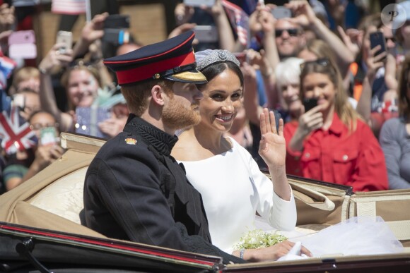 Le prince Harry et Meghan Markle, duc et duchesse de Sussex, ont effectué une procession dans le landau Ascot après leur mariage en la chapelle St George à Windsor le 19 mai 2018, à la rencontre du public dans toute la ville de Windsor et le long du Long Walk.