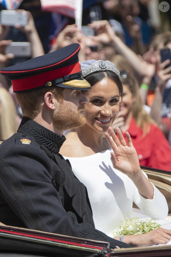 Le prince Harry et Meghan Markle, duc et duchesse de Sussex, ont effectué une procession dans le landau Ascot après leur mariage en la chapelle St George à Windsor le 19 mai 2018, à la rencontre du public dans toute la ville de Windsor et le long du Long Walk.