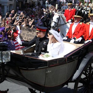 Le prince Harry et Meghan Markle, duc et duchesse de Sussex, ont effectué une procession dans le landau Ascot après leur mariage en la chapelle St George à Windsor le 19 mai 2018, à la rencontre du public dans toute la ville de Windsor et le long du Long Walk.