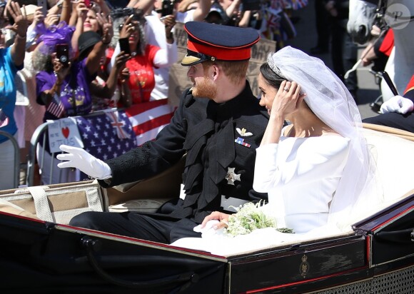 Le prince Harry et Meghan Markle, duc et duchesse de Sussex, ont effectué une procession dans le landau Ascot après leur mariage en la chapelle St George à Windsor le 19 mai 2018, à la rencontre du public dans toute la ville de Windsor et le long du Long Walk.