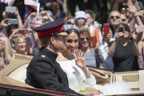 Le prince Harry et Meghan Markle, duc et duchesse de Sussex, ont fait une procession dans le landau Ascot après leur mariage en la chapelle St George à Windsor le 19 mai 2018, à la rencontre du public dans toute la ville de Windsor et le long du Long Walk.
