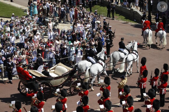 Le prince Harry et Meghan Markle, duc et duchesse de Sussex, ont fait une procession dans le landau Ascot après leur mariage en la chapelle St George à Windsor le 19 mai 2018, à la rencontre du public dans toute la ville de Windsor et le long du Long Walk.