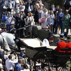 Le prince Harry et Meghan Markle, duc et duchesse de Sussex, ont fait une procession dans le landau Ascot après leur mariage en la chapelle St George à Windsor le 19 mai 2018, à la rencontre du public dans toute la ville de Windsor et le long du Long Walk.