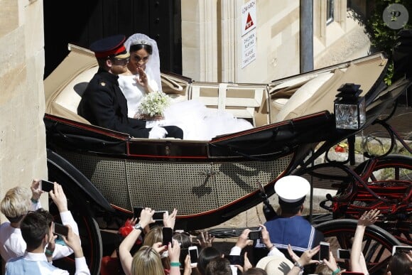 Meghan Markle et le prince Harry, duc et duchesse de Sussex, ont effectué une procession dans le landau Ascot après leur mariage en la chapelle St George à Windsor le 19 mai 2018, à la rencontre du public dans toute la ville de Windsor et le long du Long Walk.