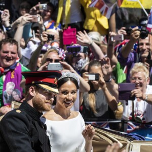 Meghan Markle et le prince Harry, duc et duchesse de Sussex, ont effectué une procession dans le landau Ascot après leur mariage en la chapelle St George à Windsor le 19 mai 2018, à la rencontre du public dans toute la ville de Windsor et le long du Long Walk.