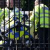Le prince George de Cambridge tout heureux sur une moto de la police de Londres, le 24 mai 2016.