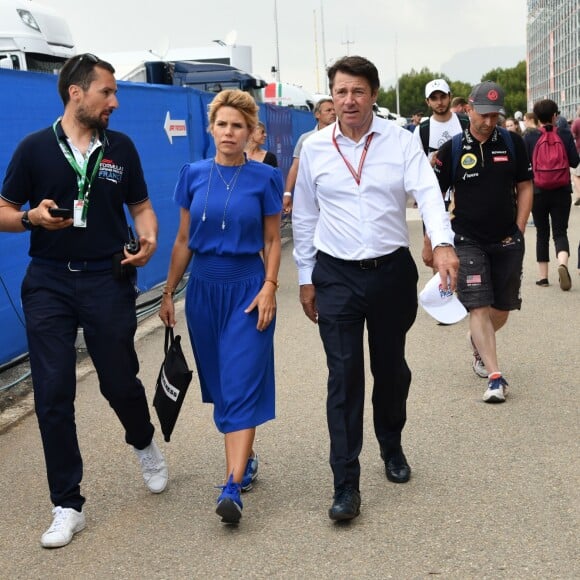 Exclusif - Christian Estrosi et sa femme Laura Tenoudji accompagné par Ludovic Arnault, le directeur délégué du Grand Prix de France, durant la journée d'essai du Grand Prix de France au Castellet le 23 juin 2018. Ils ont visité le Village situé derrière les tribunes et ouvert au public. Christian Estrosi, le maire de Nice et le vice président du Conseil Regional de PACA, est à l'origine du retour du Grand prix de France au Circuit Paul Ricard. © Bruno Bebert/Bestimage