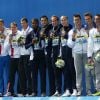 Les médaillés d'argent (Russie), Mehdy Metella, Florent Manaudou, Fabien Gilot et Jérémy Stravius et les médaillés de bronze (Italie) - Les français, médaillés d'or du 4x100m de nage libre lors des championnats du monde de natation à Kazan en Russie. Le 2 août 2015