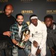 Steven Nzonzi, Adil Rami, Paul Pogba et Samuel Umtiti posent avec le trophée de la Coupe du monde FIFA 2018 lors de la soirée Maxim Hot 100 Experience au Hollywood Palladium à Los Angeles, le 21 juillet 2018.