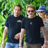 Johnny Hallyday et sa femme Laeticia quittent leur hôtel en compagnie de Sébastien Farran et du père de Laeticia, André Boudou à Miami, le 12 mai 2014.