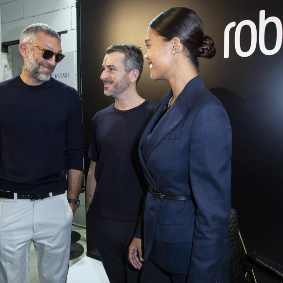 Vincent Cassel, Paul Surridge, Tina Kunakey au défilé Roberto Cavalli lors de la Fashion Week de Milan prêt-à-porter printemps/été 2019 le 22 septembre 2018.