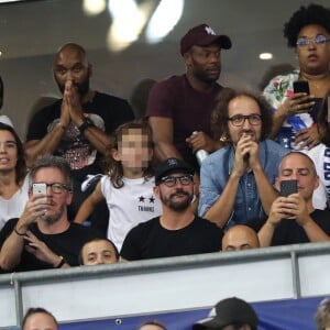 Sylvain Wiltord, Élodie Bouchez, son mari Thomas Bangalter (groupe Daft Punk), leur fils Roxan et Tara-Jay, Jean-Luc Lemoine et Cartman (aka Sébastien Patoche, de son vrai nom Nicolas-Bonaventure Ciattoni) dans les tribunes lors de la Ligue des nations opposant la France aux Pays-Bas, au Stade de France, à Saint-Denis, Seine Saint-Denis, France, le 9 septembre 2018.