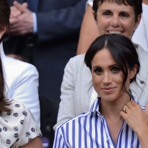 Kate Middleton et Meghan Markle, duchesse de Cambridge et duchesse de Sussex, à Wimbledon le 14 juillet 2018.