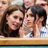 Kate Middleton et Meghan Markle, duchesse de Cambridge et duchesse de Sussex, à Wimbledon le 14 juillet 2018.