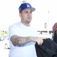 Rob Kardashian et sa compagne Blac Chyna vont prendre un vol à l'aéroport de LAX à Los Angeles, le 25 mars 2016.