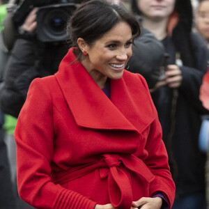 Le prince Harry, duc de Sussex, et Meghan Markle, duchesse de Sussex (enceinte) lors d'une visite à Birkenhead le 14 janvier 2019.