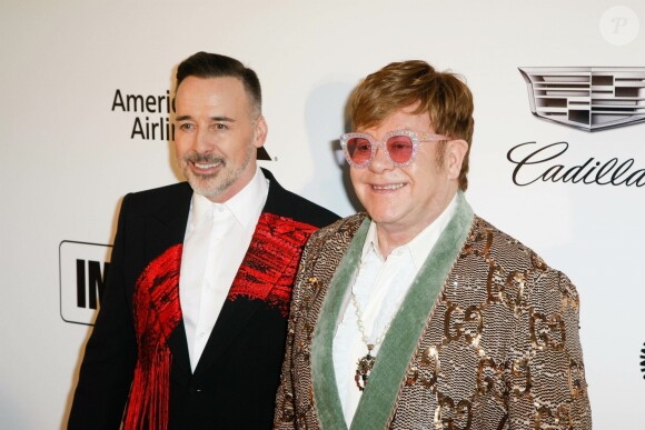 David Furnish et son mari Elton John à la soirée caritative AIDS Foundation Academy Awards Viewing Party à Los Angeles, le 24 février 2019