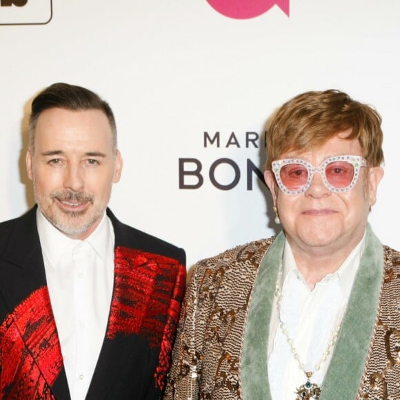 David Furnish et son mari Elton John à la soirée caritative AIDS Foundation Academy Awards Viewing Party à Los Angeles, le 24 février 2019