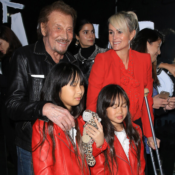 Johnny Hallyday, sa femme Laeticia et leurs filles Jade et Joy au vernissage de l'exposition du photographe Mathieu Cesar à Los Angeles. Le 21 février 2017.