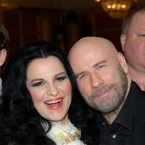 John Travolta posant avec la soprano Angela Gheorghiu au dîner de gala de la soirée des Bravo Classical Music Awards à Moscou le 21 mars 2019. © Persona Stars via ZUMA Press / Bestimage