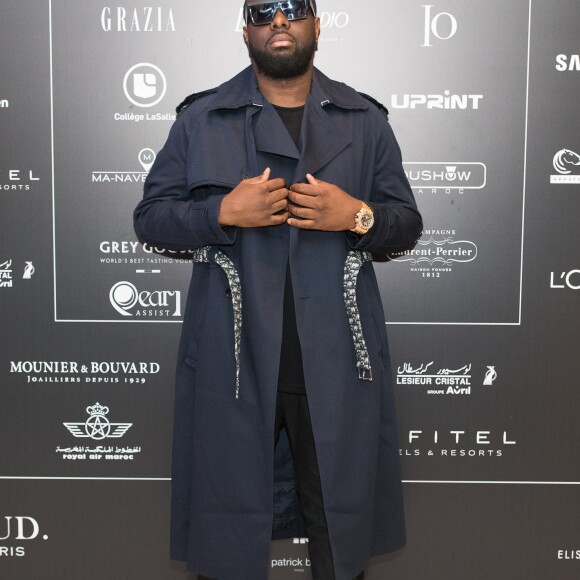 Exclusif - Le rappeur Gims (Maître Gims - Gandhi Djuna) lors du photocall de la 14ème édition du Casa Fashion Show au Sofitel Casablanca Tour Blanche à Casablanca, Maroc, le 20 avril 2019. Sept ans déjà que le Casa Fashion Show promeut la femme marocaine citoyenne du monde. Devenu un rendez-vous incontournable et placé sous le Haut Patronage de Sa Majesté le Roi du Maroc, l'événement porté par K.Cheddadi et chorégraphié par H.Ghorab, se veut le reflet d'une société plurielle et avant-gardiste, jonglant avec brio entre ses racines orientales et sa culture occidentale. Une société solidaire également... L'événement soutenant depuis son lancement l'Association des Bonnes Œuvres du Coeur dont l'objectif est de redonner un souffle de vie et d'espoir aux bébés bleus. Le Casa Fashion Show dévoile au public marocain les collections Printemps/Eté 2019 des griffes les plus prestigieuses : de Etro à Oud Paris, en passant par Elisabetta Franchi, Pinko, Dice Kayek, Just Cavalli ou encore Orza Couture... Les créateurs marocains Lina Cahill et Sara Chraibi revisitent la robe du soir, avec cet oeil aiguisé et ce sens pointu du détail qui les caractérisent. Le talentueux couturier tunisien, Ali Karoui (souvent surnommé le nouveau Azzedine Alaia), est présent pour la seconde fois consécutive. Enfin, l'enseigne marocaine de luxe IO sera la chaussure officielle de l'événement et l'Oréal Paris, le partenaire coiffure et make up du show. © Philippe Doignon/Bestimage