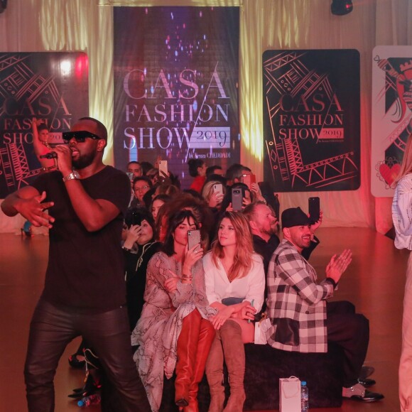 Exclusif - Le rappeur Gims (Maître Gims - Gandhi Djuna) et la chanteuse Vitaa lors du défilé de la 14ème édition du Casa Fashion Show au Sofitel Casablanca Tour Blanche à Casablanca, Maroc, le 20 avril 2019. Sept ans déjà que le Casa Fashion Show promeut la femme marocaine citoyenne du monde. Devenu un rendez-vous incontournable et placé sous le Haut Patronage de Sa Majesté le Roi du Maroc, l'événement porté par K.Cheddadi et chorégraphié par H.Ghorab, se veut le reflet d'une société plurielle et avant-gardiste, jonglant avec brio entre ses racines orientales et sa culture occidentale. Une société solidaire également… L'événement soutenant depuis son lancement l’Association des Bonnes Œuvres du Cœur dont l’objectif est de redonner un souffle de vie et d’espoir aux bébés bleus. Le Casa Fashion Show dévoile au public marocain les collections Printemps/Eté 2019 des griffes les plus prestigieuses : de Etro à Oud Paris, en passant par Elisabetta Franchi, Pinko, Dice Kayek, Just Cavalli ou encore Orza Couture… Les créateurs marocains Lina Cahill et Sara Chraibi revisitent la robe du soir, avec cet œil aiguisé et ce sens pointu du détail qui les caractérisent. Le talentueux couturier tunisien, Ali Karoui (souvent surnommé le nouveau Azzedine Alaia), est présent pour la seconde fois consécutive. Enfin, l’enseigne marocaine de luxe IO sera la chaussure officielle de l’événement et l’Oréal Paris, le partenaire coiffure et make up du show. © Philippe Doignon/Bestimage