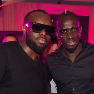 Exclusif - Le rappeur Gims (Maître Gims - Gandhi Djuna), Mamadou Sakho et sa femme Majda lors de la 14ème édition du Casa Fashion Show au Sofitel Casablanca Tour Blanche à Casablanca, Maroc, le 20 avril 2019. Sept ans déjà que le Casa Fashion Show promeut la femme marocaine citoyenne du monde. Devenu un rendez-vous incontournable et placé sous le Haut Patronage de Sa Majesté le Roi du Maroc, l'événement porté par K.Cheddadi et chorégraphié par H.Ghorab, se veut le reflet d'une société plurielle et avant-gardiste, jonglant avec brio entre ses racines orientales et sa culture occidentale. Une société solidaire également… L'événement soutenant depuis son lancement l’Association des Bonnes Œuvres du Cœur dont l’objectif est de redonner un souffle de vie et d’espoir aux bébés bleus. Le Casa Fashion Show dévoile au public marocain les collections Printemps/Eté 2019 des griffes les plus prestigieuses : de Etro à Oud Paris, en passant par Elisabetta Franchi, Pinko, Dice Kayek, Just Cavalli ou encore Orza Couture… Les créateurs marocains Lina Cahill et Sara Chraibi revisitent la robe du soir, avec cet œil aiguisé et ce sens pointu du détail qui les caractérisent. Le talentueux couturier tunisien, Ali Karoui (souvent surnommé le nouveau Azzedine Alaia), est présent pour la seconde fois consécutive. Enfin, l’enseigne marocaine de luxe IO sera la chaussure officielle de l’événement et l’Oréal Paris, le partenaire coiffure et make up du show. © Philippe Doignon/Bestimage