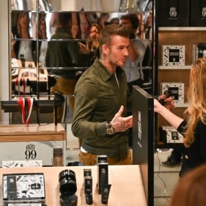 David Beckham fait la promotion de ses produits cosmétiques pour hommes House 99 (soins pour le visage, la barbe, le corps et les cheveux) dans la boutique éphémère le de House 99 aux Galeries Lafayette Champs-Élysées, à Paris, France, le 21 mai 2019.