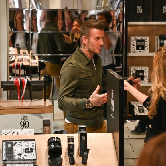 David Beckham fait la promotion de ses produits cosmétiques pour hommes House 99 (soins pour le visage, la barbe, le corps et les cheveux) dans la boutique éphémère le de House 99 aux Galeries Lafayette Champs-Élysées, à Paris, France, le 21 mai 2019.