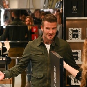 David Beckham fait la promotion de ses produits cosmétiques pour hommes House 99 (soins pour le visage, la barbe, le corps et les cheveux) dans la boutique éphémère le de House 99 aux Galeries Lafayette Champs-Élysées, à Paris, France, le 21 mai 2019.