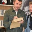 David Beckham fait la promotion de ses produits cosmétiques pour hommes House 99 (soins pour le visage, la barbe, le corps et les cheveux) dans la boutique éphémère le de House 99 aux Galeries Lafayette Champs-Élysées, à Paris, France, le 21 mai 2019.