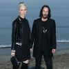 Alexandra Grant et Keanu Reeves assistent au défilé Saint Laurent, collection homme printemps-été 2020 à Malibu. Le 6 juin 2019.