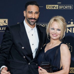 Adil Rami et Pamela Anderson au photocall de la 28ème cérémonie des trophées UNFP (Union nationale des footballeurs professionnels) au Pavillon d'Armenonville à Paris, France, le 19 mai 2019.