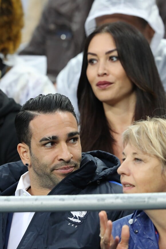 Adil Rami et Sidonie Biémont enceinte lors du match du quart de finale de l'UEFA Euro 2016 France-Islande au Stade de France à Saint-Denis, le 3 juillet 2016. © Cyril Moreau/Bestimage