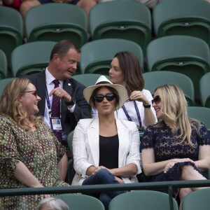 Meghan Markle, duchesse de Sussex, assiste au match "Serena Williams vs Kaja Juvan (2/6 - 6/2 - 6/4)" au Tournoi de Wimbledon 2019, le 4 juillet 2019.