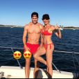 Véronique Zidane, sublime en bikini rouge, pose avec son fils Luca lors de vacances à Ibiza le 1er juillet 2017.