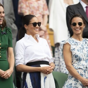 Catherine (Kate) Middleton, duchesse de Cambridge, Meghan Markle, duchesse de Sussex, et Pippa Middleton dans les tribunes lors de la finale femme de Wimbledon "Serena Williams - Simona Halep (2/6 - 2/6) à Londres, le 13 juillet 2019.