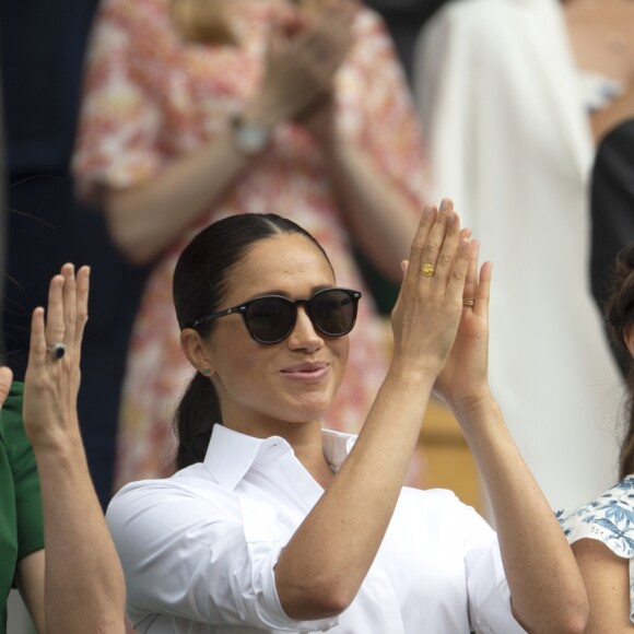 Catherine (Kate) Middleton, duchesse de Cambridge, Meghan Markle, duchesse de Sussex, et Pippa Middleton dans les tribunes lors de la finale femme de Wimbledon "Serena Williams - Simona Halep (2/6 - 2/6) à Londres, le 13 juillet 2019.