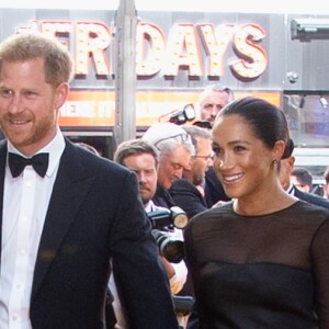 Meghan Markle, duchesse de Sussex, avec le prince Harry lors de la première du film Le Roi Lion au cinéma Odeon Luxe Leicester Square à Londres, le 14 juillet 2019.