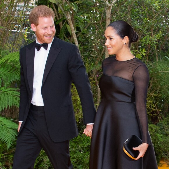 Meghan Markle, duchesse de Sussex, avec le prince Harry lors de la première du film Le Roi Lion au cinéma Odeon Luxe Leicester Square à Londres, le 14 juillet 2019.